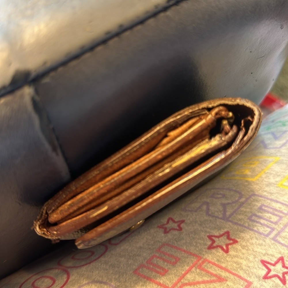 Louis Vuitton billfold. The dimensions are 6 inches wide and 4 inches. Authentic - Picture 8 of 10